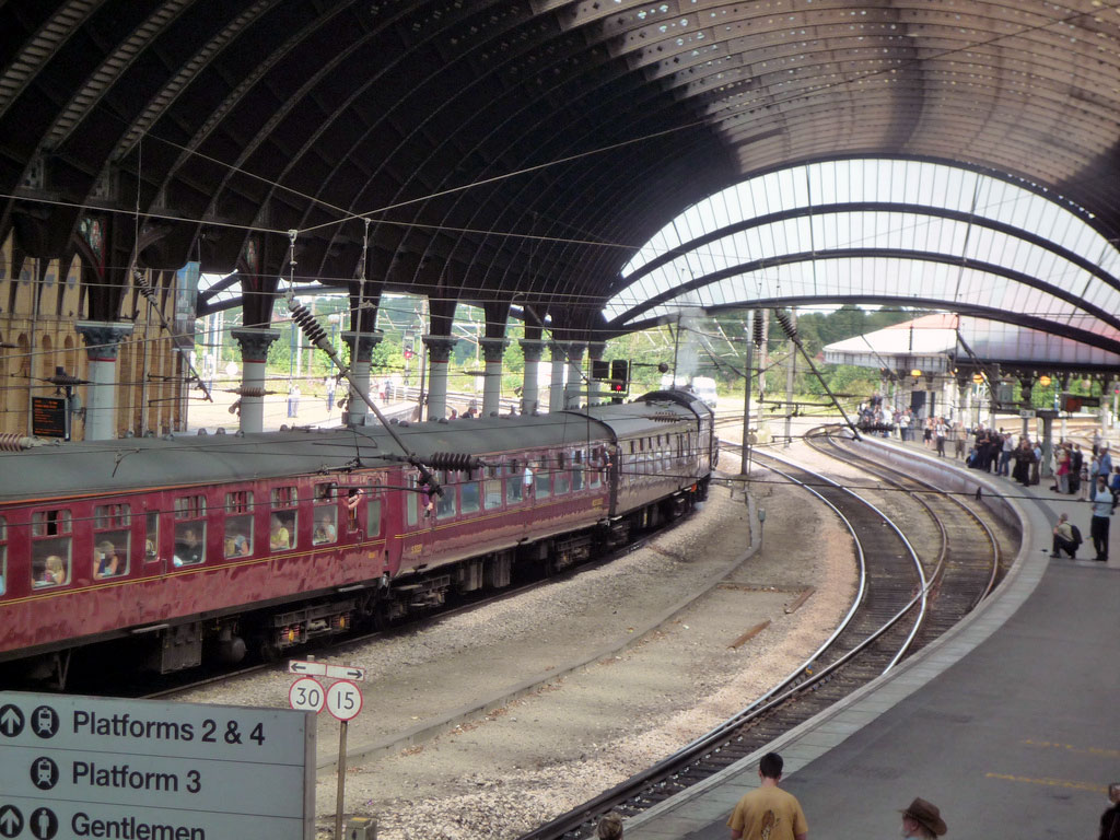 Steam Train thunders through York station.